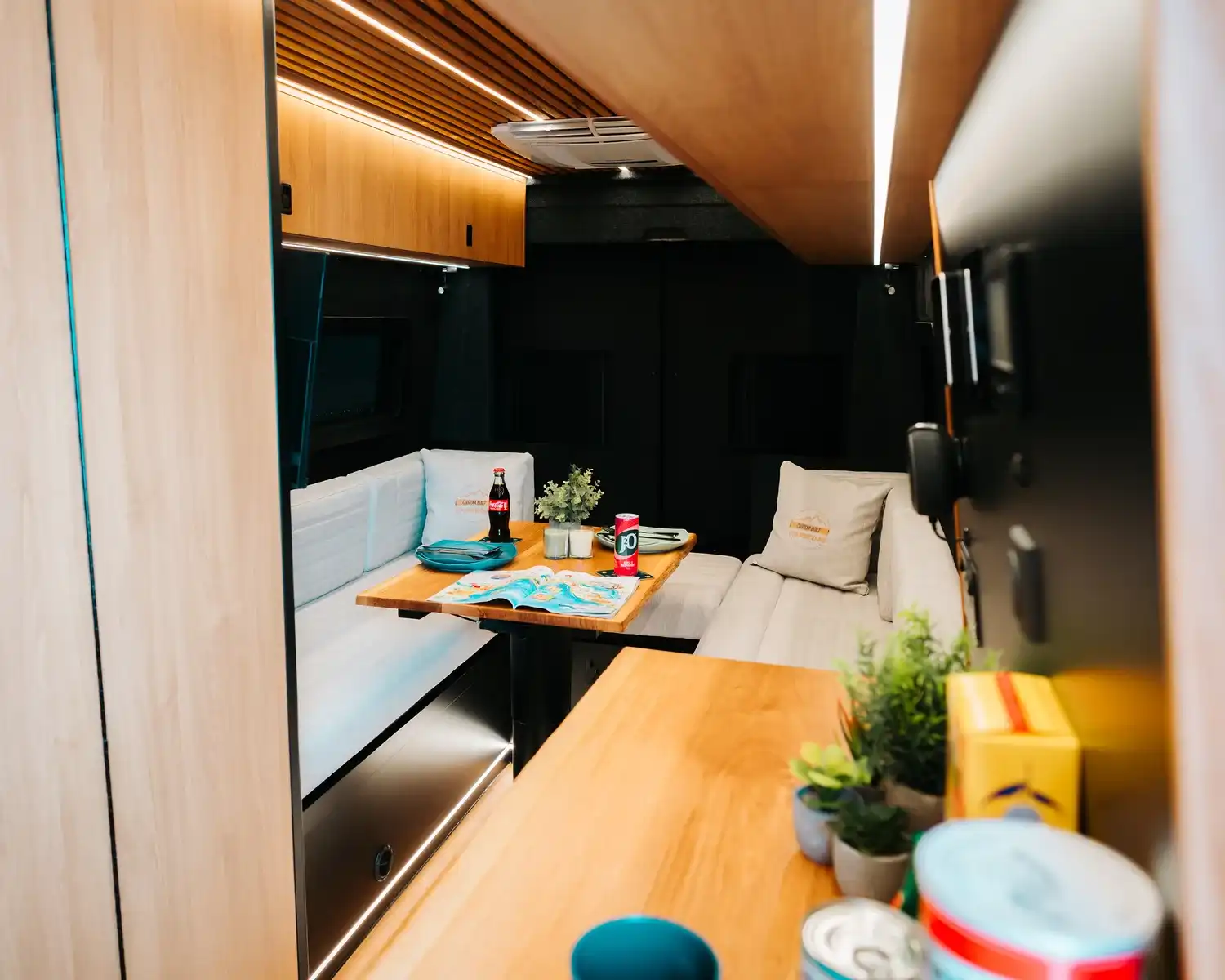 Lounge and kitchen, bespoke 4x4 Mercedes Sprinter campervan