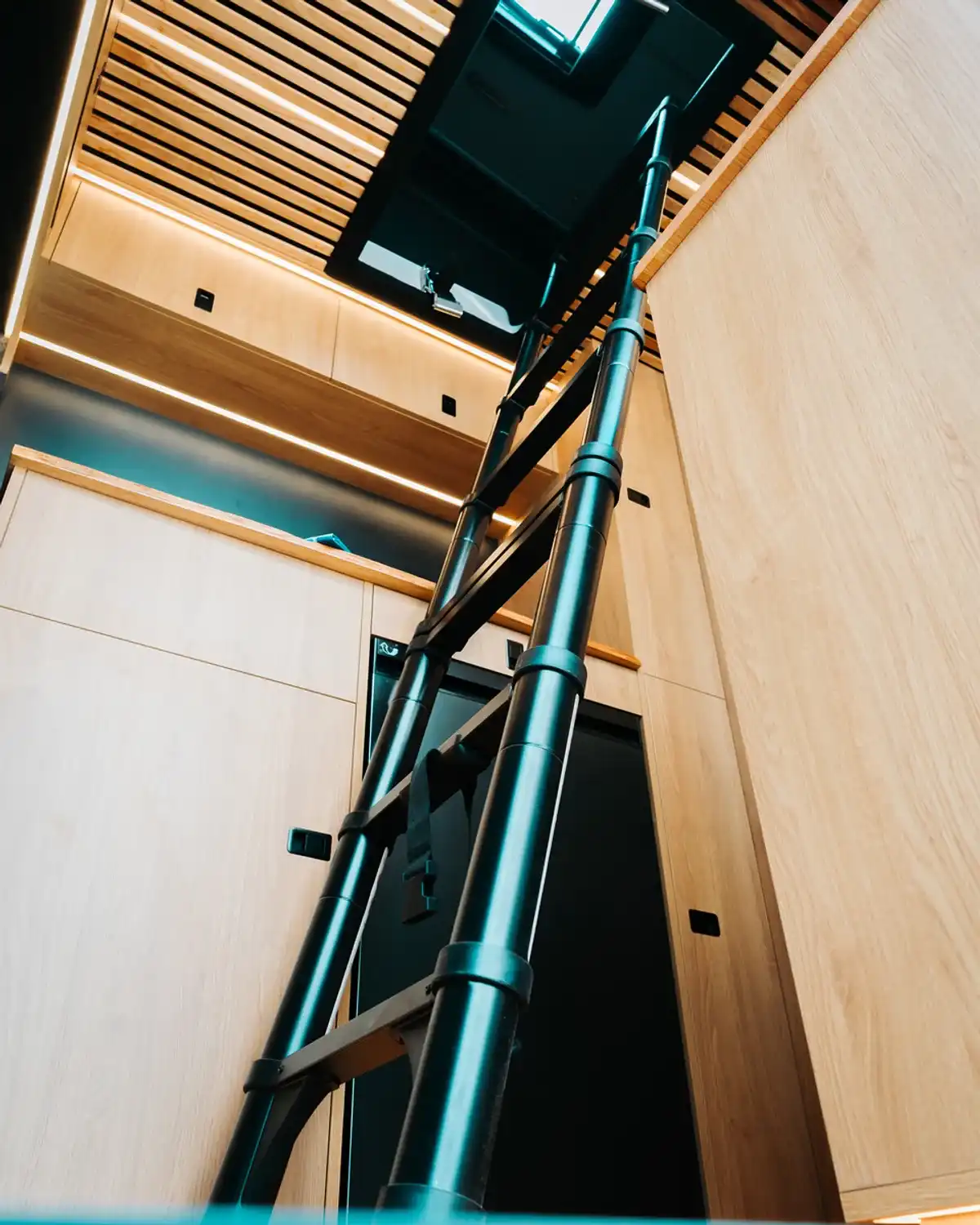 Ladder up to the pop-top, bespoke 4x4 Mercedes Sprinter campervan