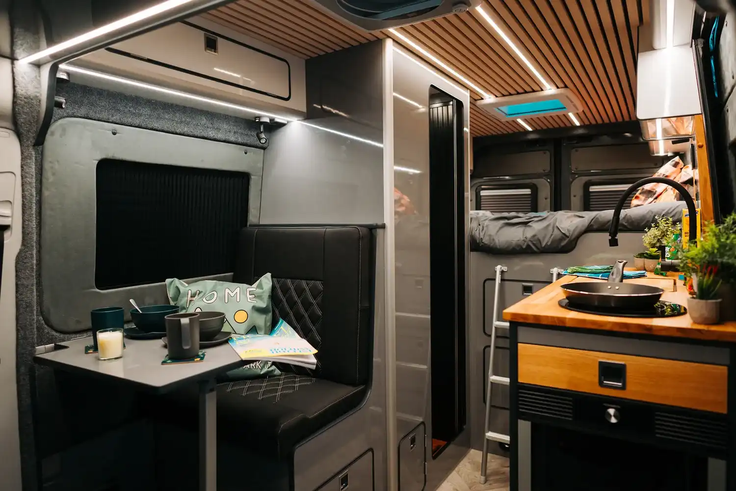 Dinette and kitchen inside a Ventus VW Crafter campervan