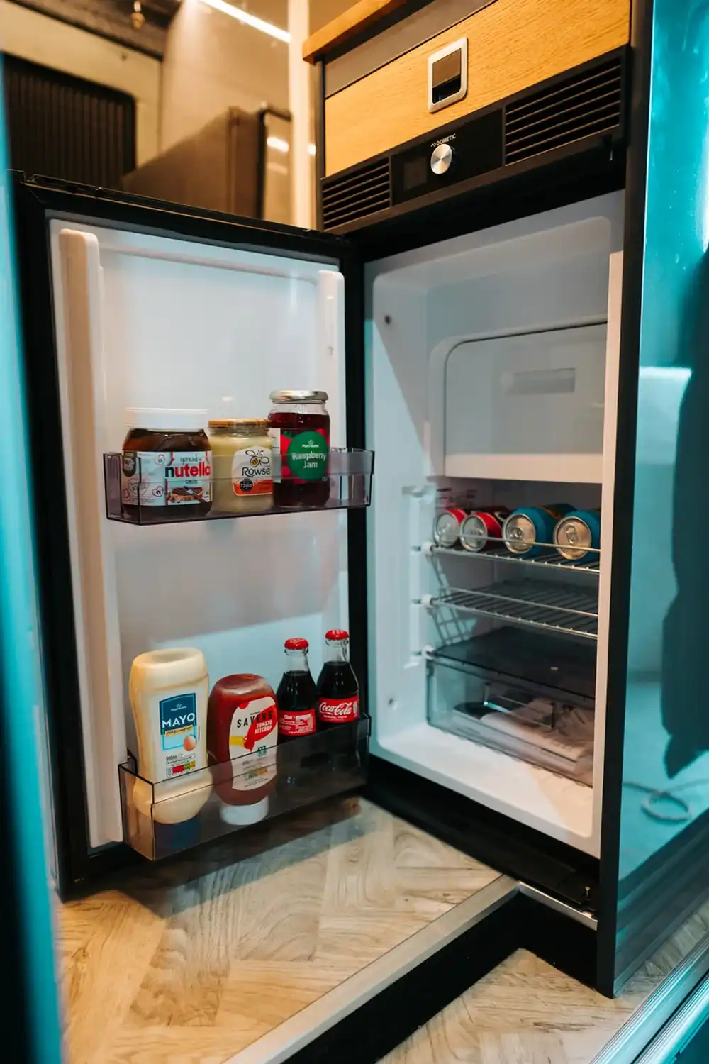 Fridge built into the kitchen of a Ventus VW Crafter campervan