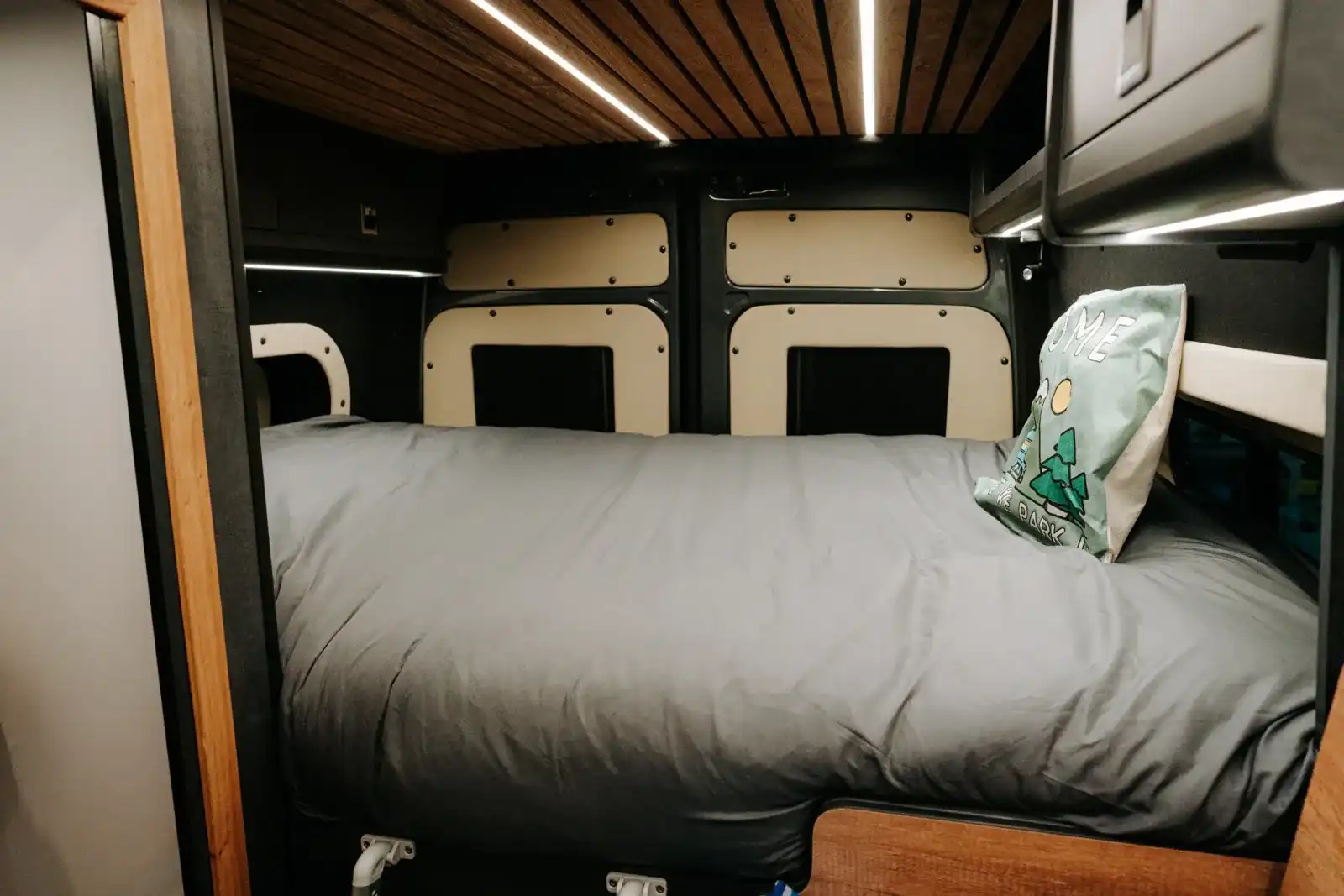Fixed bed across the back of a Ventus Pop-top MAN TGE campervan