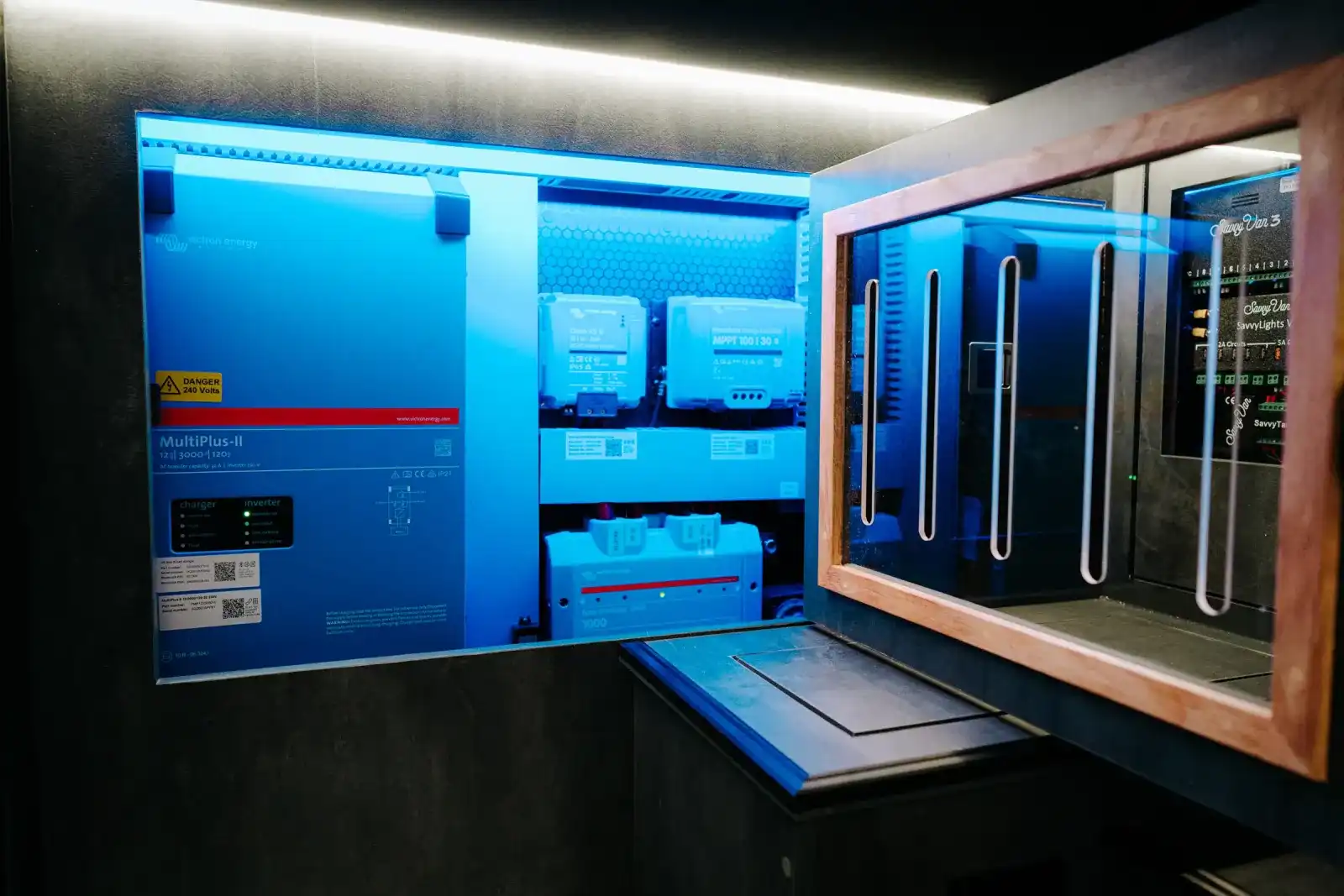 Victron power system cupboard under the bed of a Ventus Pop-top campervan